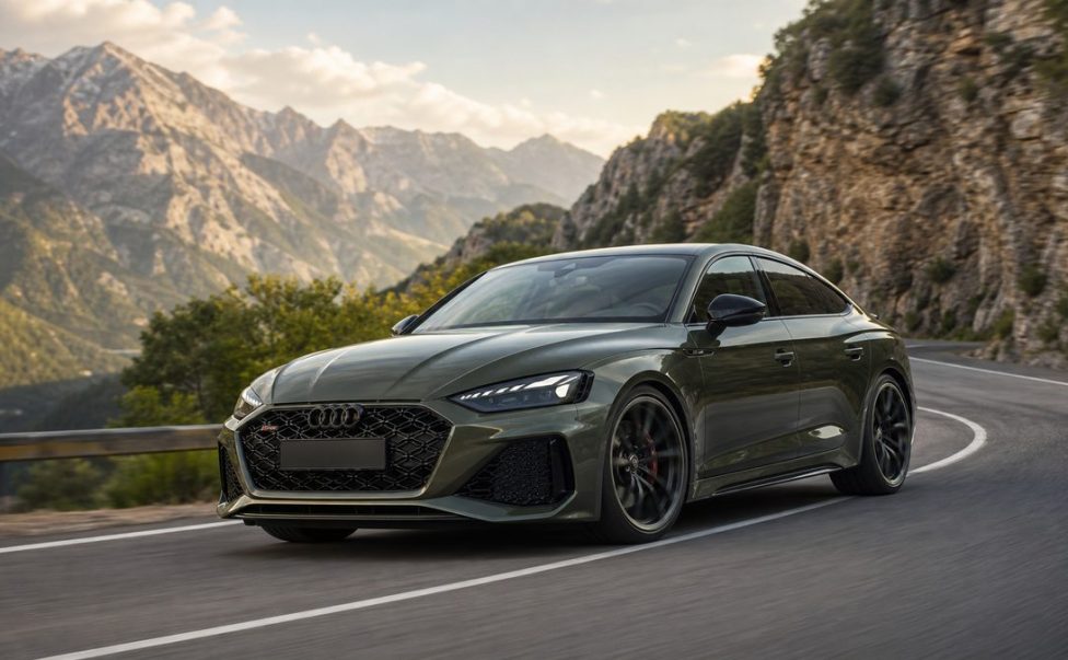 Bedford green 2027 Audi RS 5 Sedan cornering on a mountain road